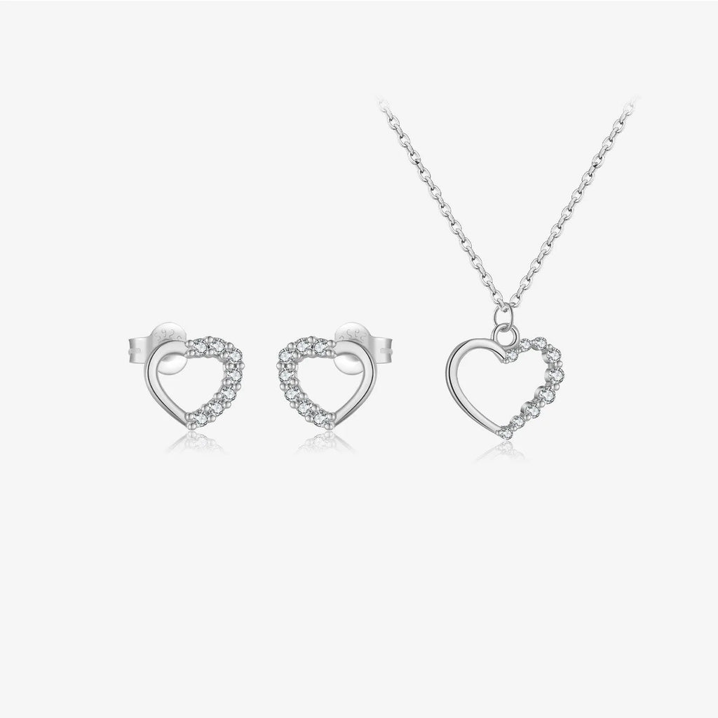 Sterling silver hollow heart pendant necklace on a regular chain, available in white gold or platinum plating.