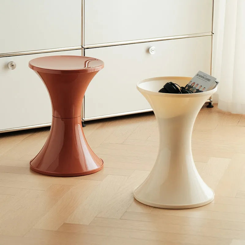 Plastic hourglass shoe changing stool in green colour showing contoured seating design