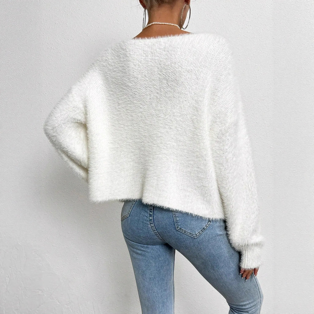 White V-neck women's cardigan sweater made from polyester knit fabric.