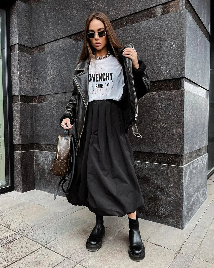Women's cotton long skirt in black solid colour with knee-length design