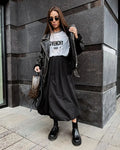 Women's cotton long skirt in black solid colour with knee-length design