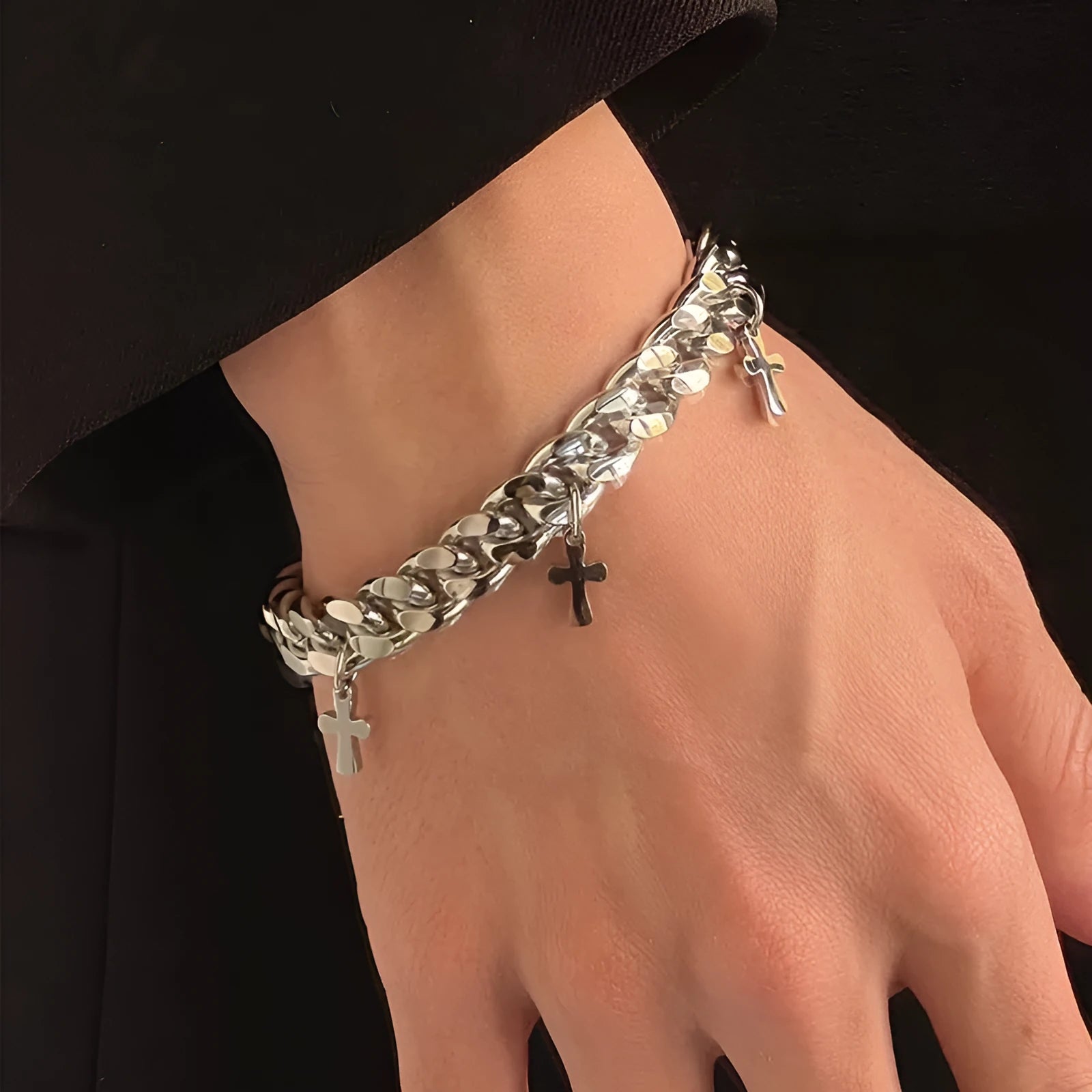 Men's titanium steel bracelet showing geometric cross design on a wrist.
