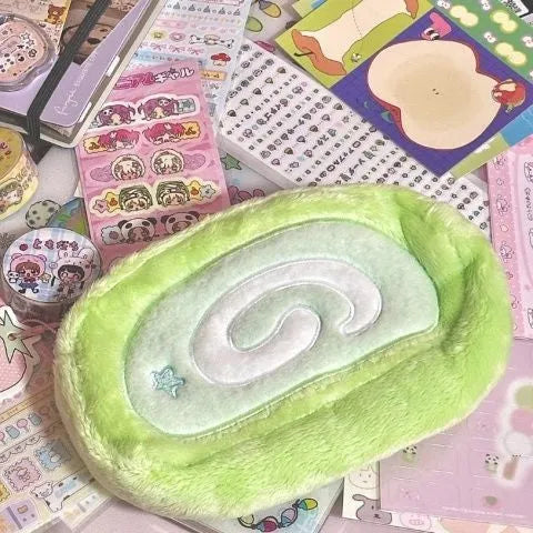 Cream and pink Swiss roll cake design velvet pencil case roll organiser.