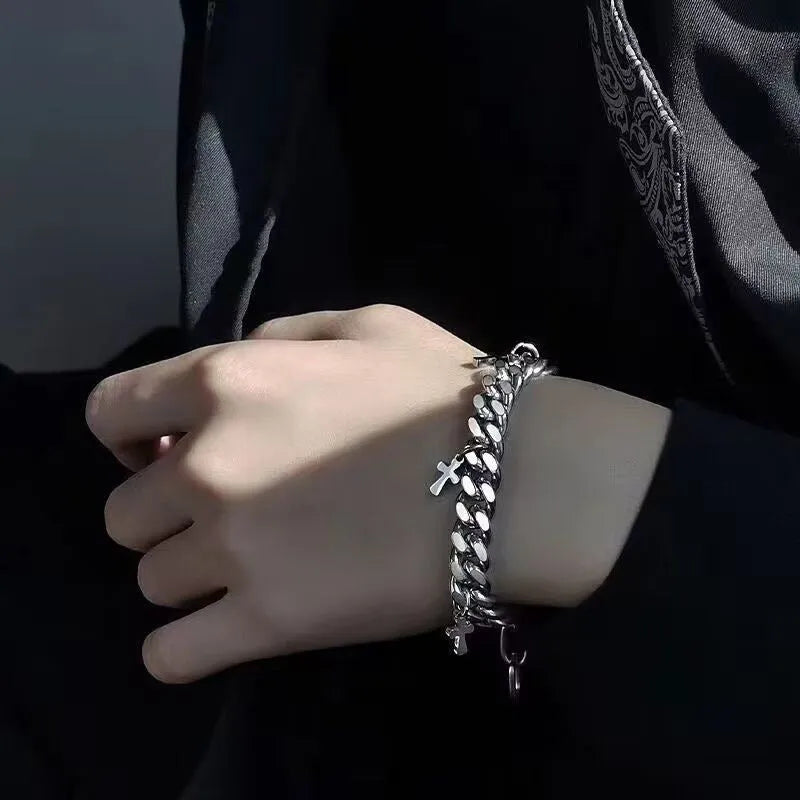 Men's titanium steel bracelet showing geometric cross design on a wrist.