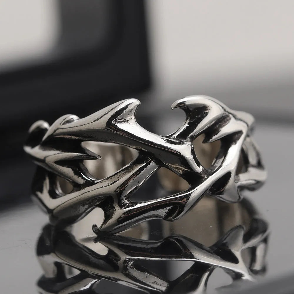 Copper thorn flower ring with adjustable opening and geometric design.