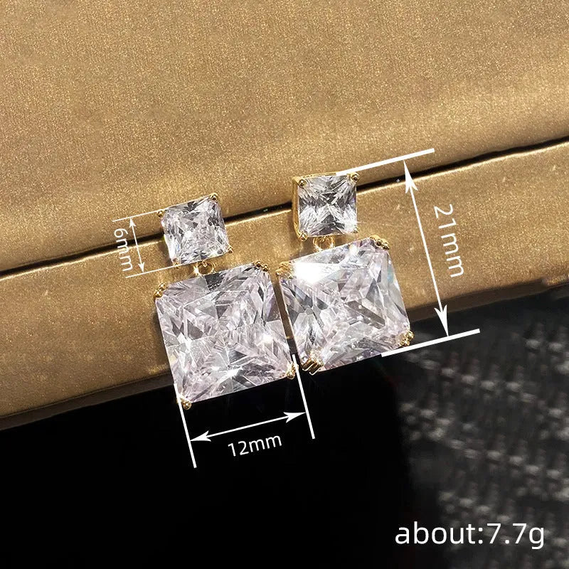 A pair of geometric square design copper earrings in a choice of white gold or gold colour.