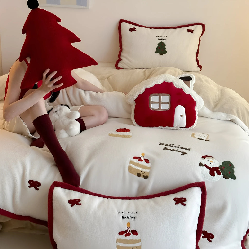 Cartoon winter Christmas themed polyester bedding four-piece set showing bed sheet, duvet cover, and pillowcases