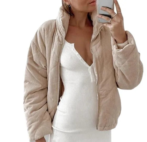 Apricot-coloured women's corduroy jacket with a stand collar and front zip, shown on a hanger.