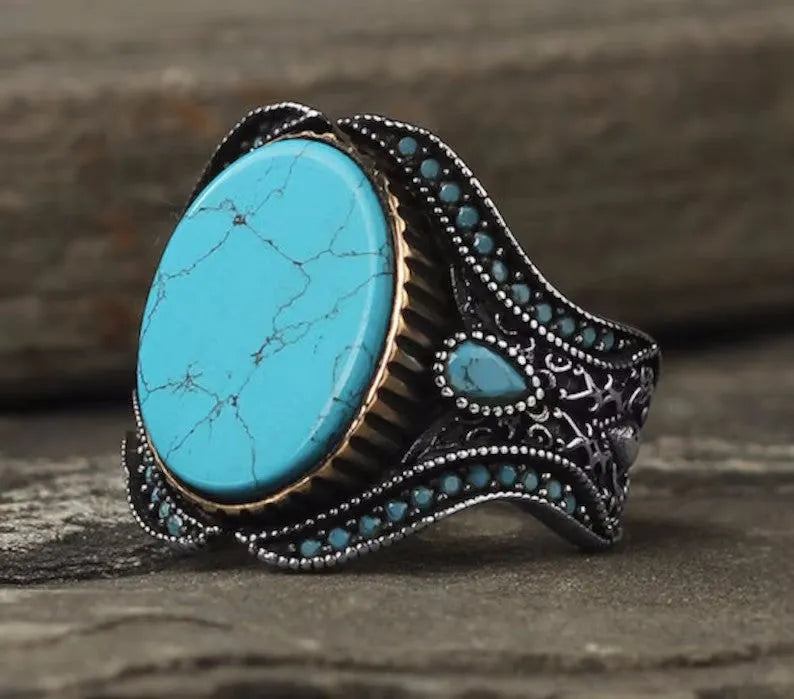 Men's antique silver alloy ring with a round band and a central turquoise gemstone.