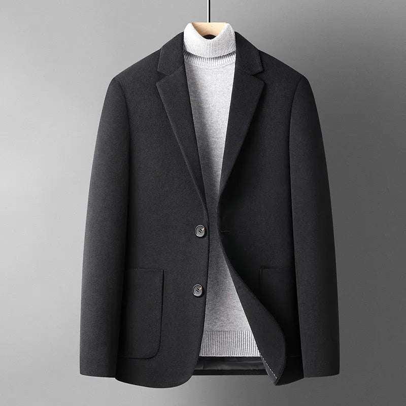 Men's slim fit wool blazer in a classic colour on a hanger, showing notch lapel and button front.