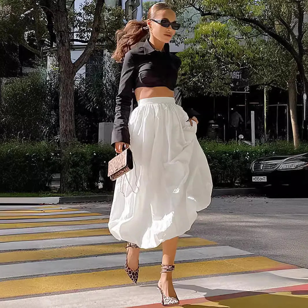 Women's cotton long skirt in black solid colour with knee-length design