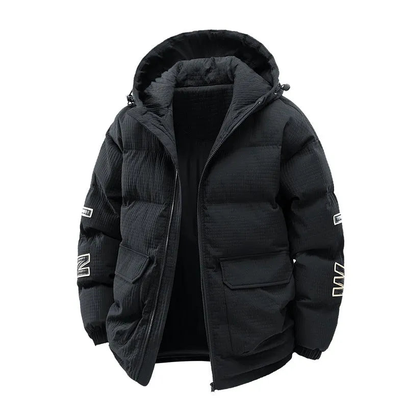 Man wearing a black hooded Korean-style winter coat with side pockets.