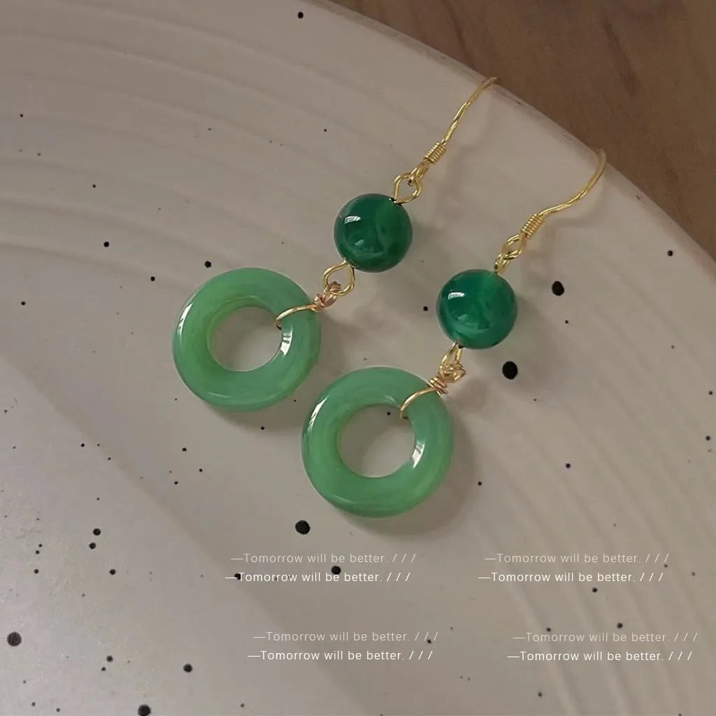 Geometric peace buckle earrings with green jade colour and 14K gold plating