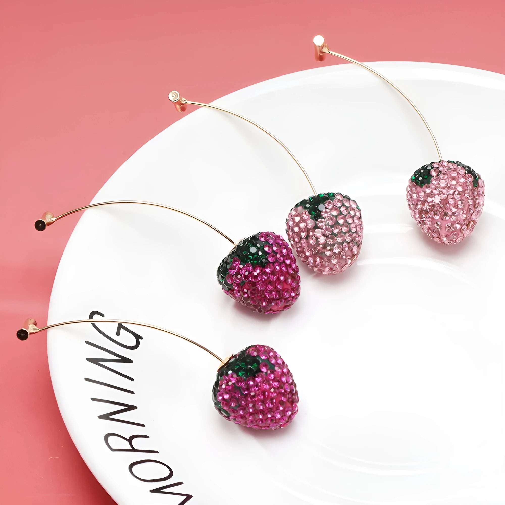 Zinc alloy strawberry stud earrings with geometric spot drill design in six colour variations