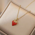 Indie fashion necklace with delicate cherry, strawberry and pepper pendant on a titanium steel O-ring chain.