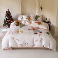 Super soft washed cotton cartoon printed bedding four-piece set on a bed, showing Gingerbread Man design.
