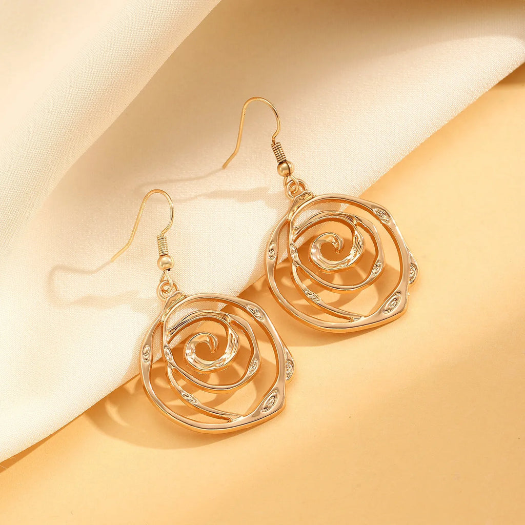 Spiral donut geometric jewellery set with necklace, bracelet, and ear hooks in gold or silver electroplated finish