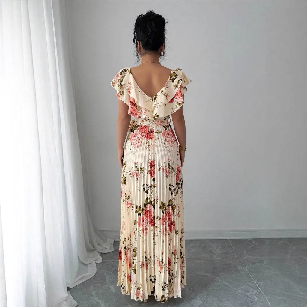 Apricot floral print V-neck dress with ruffled sleeves and a voluminous high-waisted swing skirt.
