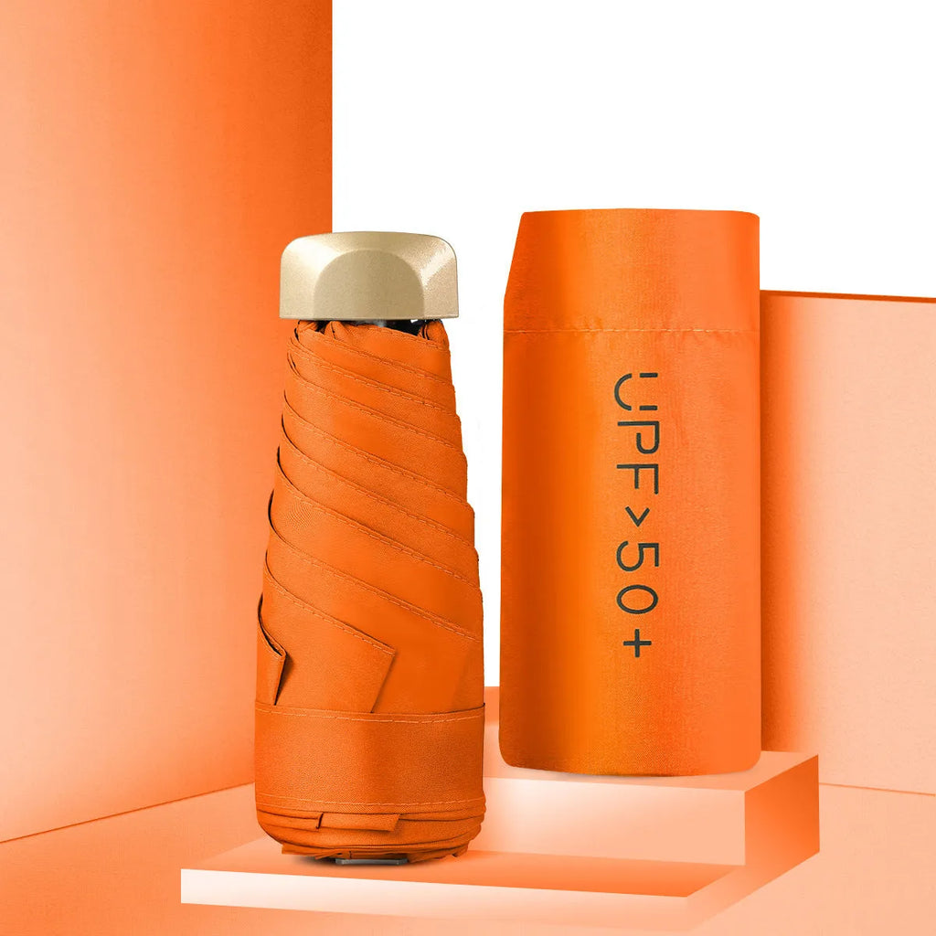 Closed five-fold compact pocket sun umbrella with a rubber handle, shown in a selection of available colours.