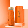 Closed five-fold compact pocket sun umbrella with a rubber handle, shown in a selection of available colours.