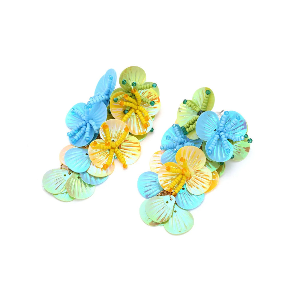 Handmade colourful flower and leaf earrings in an exaggerated dopamine style.