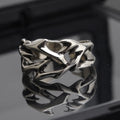 Copper thorn flower ring with adjustable opening and geometric design.