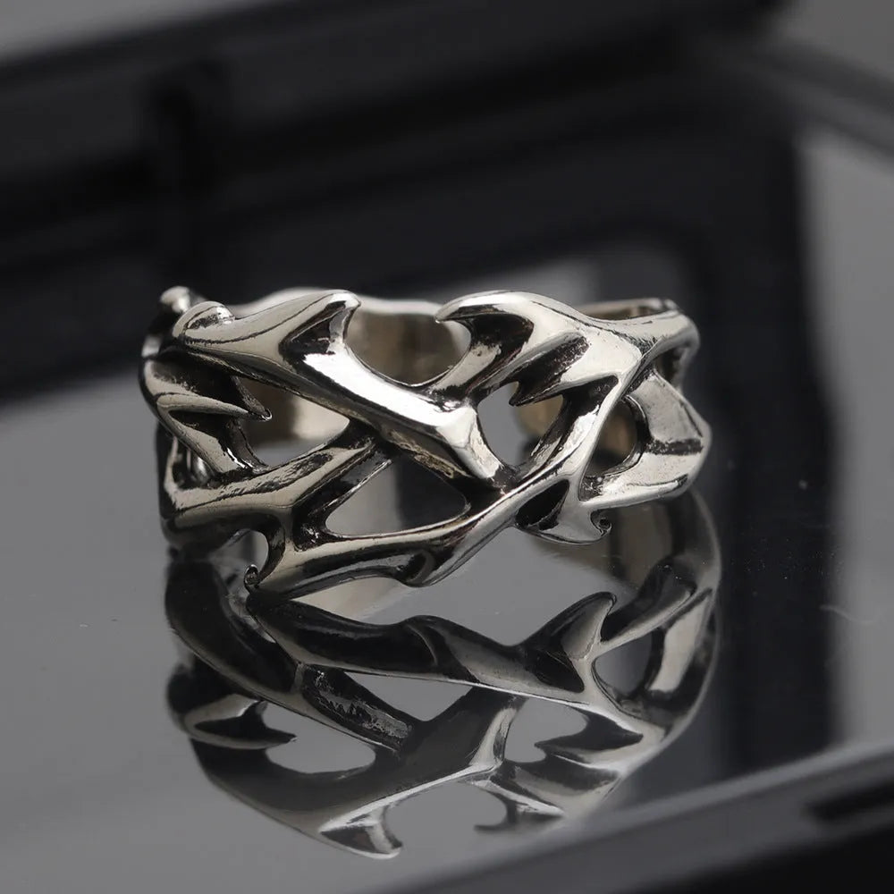 Copper thorn flower ring with adjustable opening and geometric design.