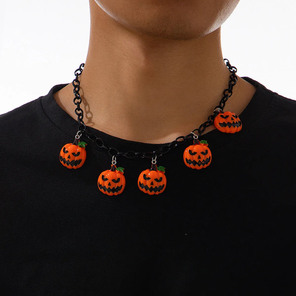 Colourful Halloween necklace showing a cartoon ghost pumpkin pendant on a chain.