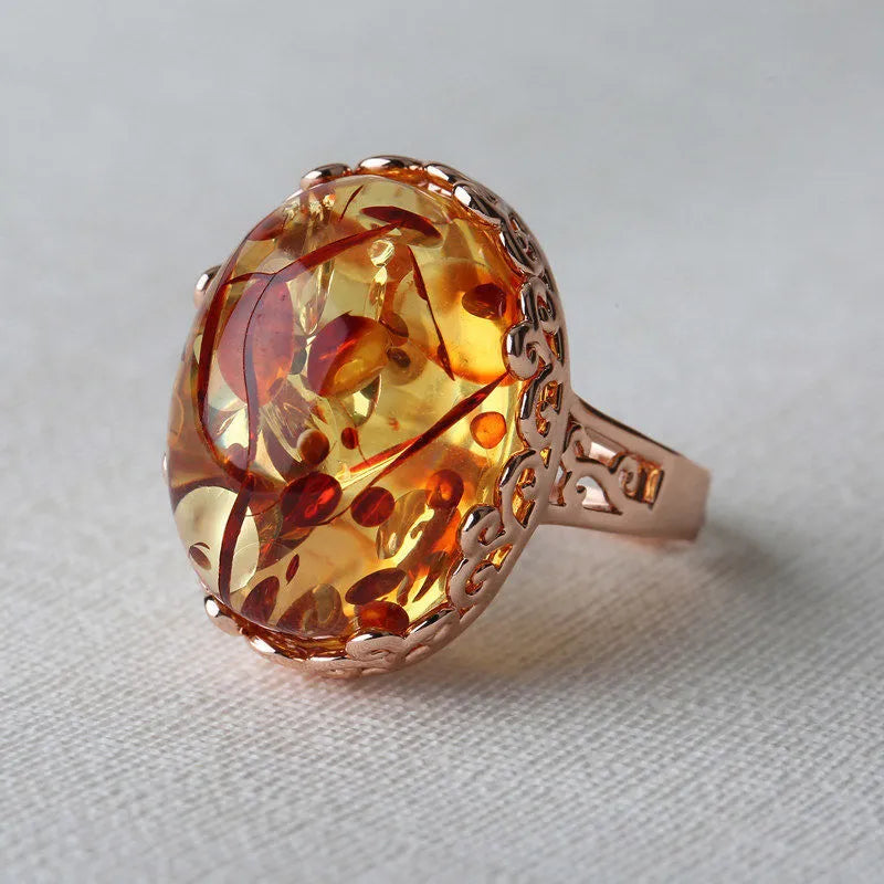 Women's beeswax amber ring in New Amber Type A colour with retro ethnic styling and alloy base