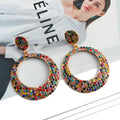 Cartoon-style metal alloy earrings with large diamond pendant drop in various colour options