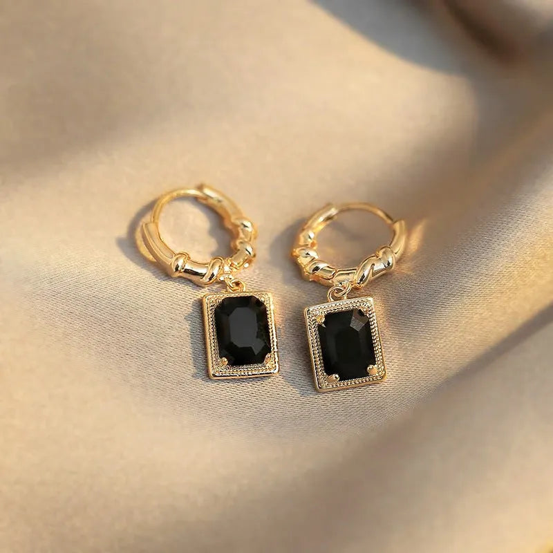 Copper earrings with geometric quadrilateral shape and black zircon stones in French Court retro style