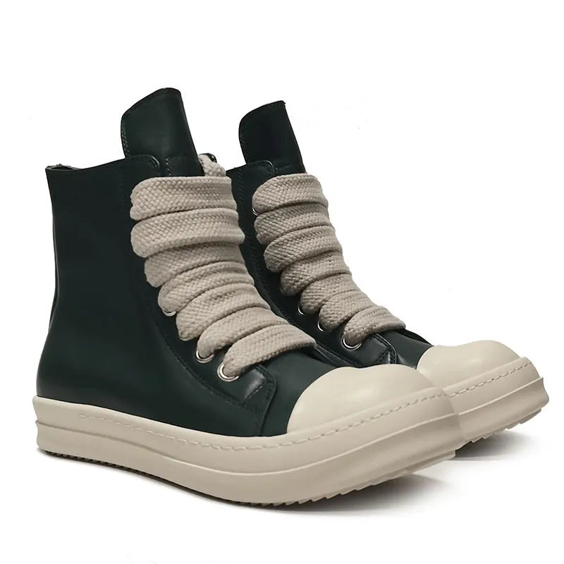 Black high-top leather sneakers with side zipper and round toe design on a white background