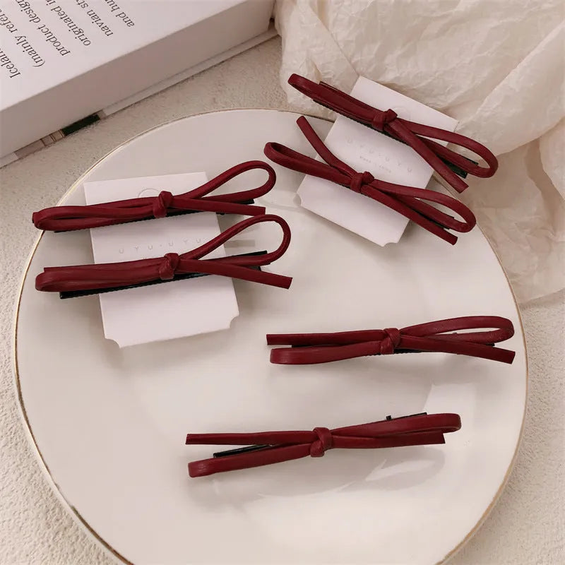 Wine red leather bow hair barrettes with handmade construction