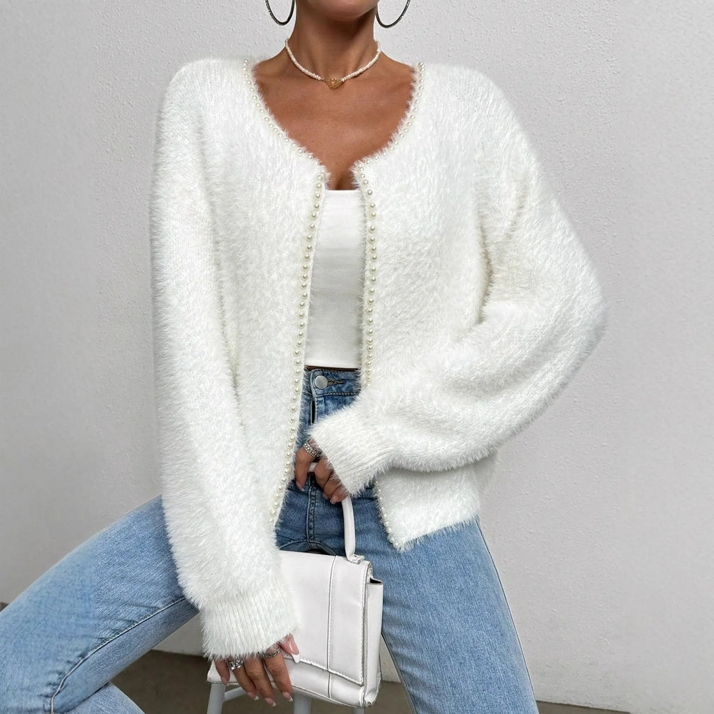 White V-neck women's cardigan sweater made from polyester knit fabric.
