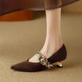 Black French pointed toe women's stiletto heels with an ankle buckle on a low-cut design.