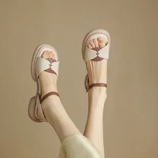 Women's khaki open toe sandals with a chunky platform heel made from renewable leather.