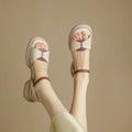 Women's khaki open toe sandals with a chunky platform heel made from renewable leather.