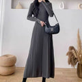 Women's high-waist polyester A-line skirt in a solid colour, mid-length below the knees.