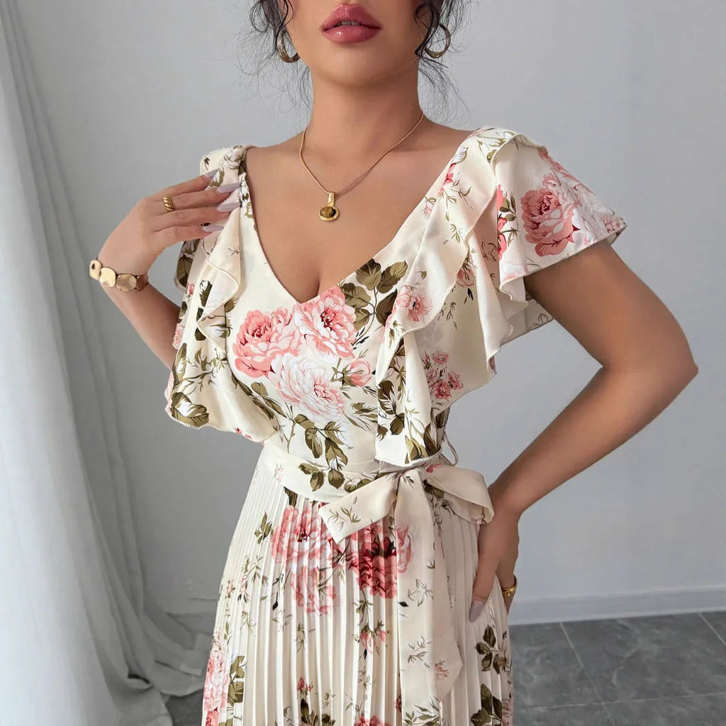Apricot floral print V-neck dress with ruffled sleeves and a voluminous high-waisted swing skirt.