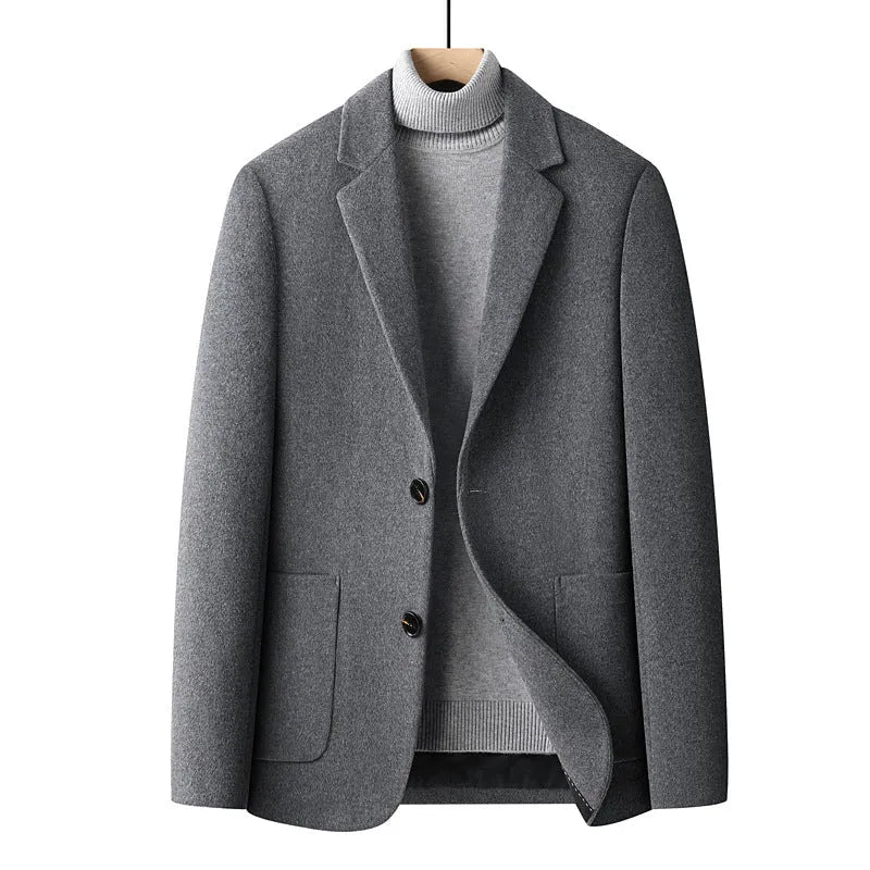 Men's slim fit wool blazer in a classic colour on a hanger, showing notch lapel and button front.