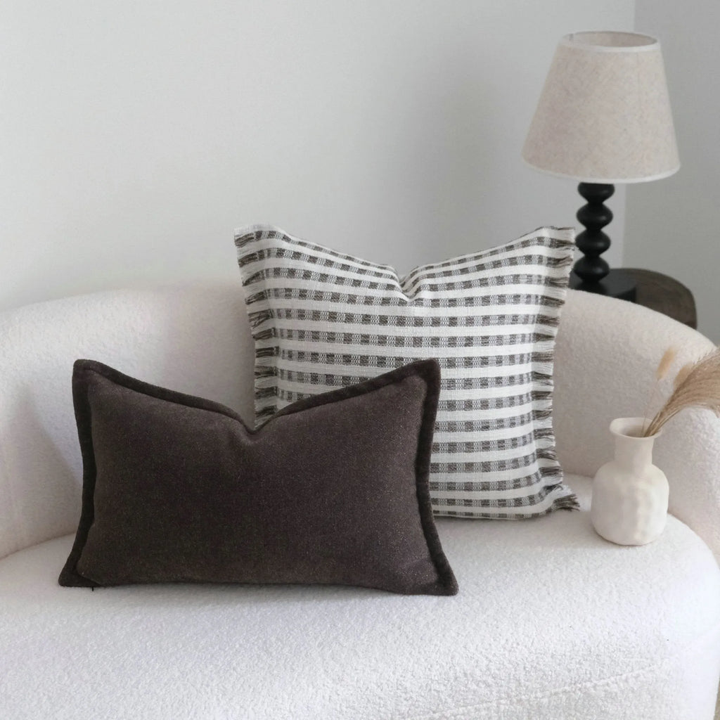 Coffee brown Chinese classical style cushion cover with stripe pattern on a living room sofa