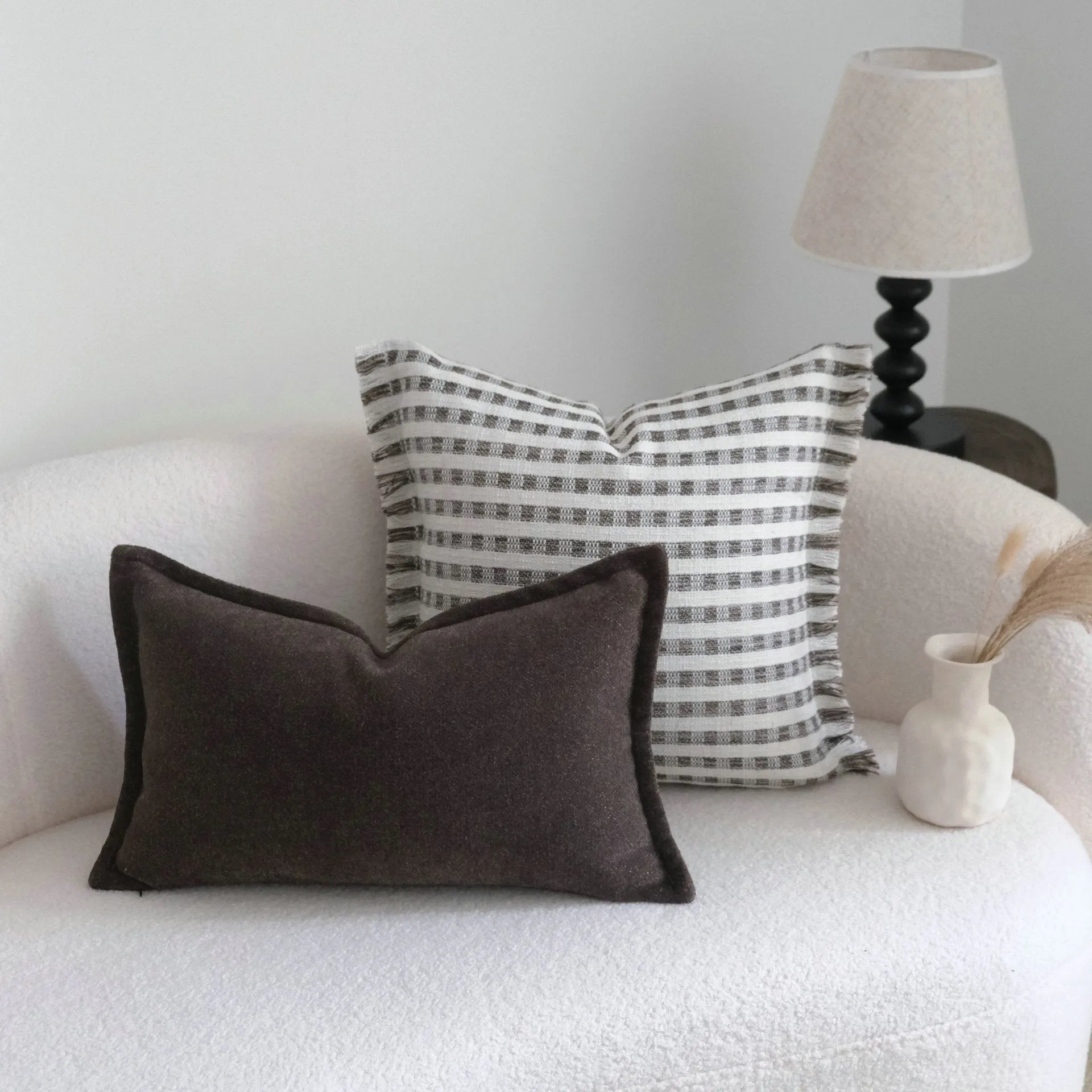 Coffee brown Chinese classical style cushion cover with stripe pattern on a living room sofa