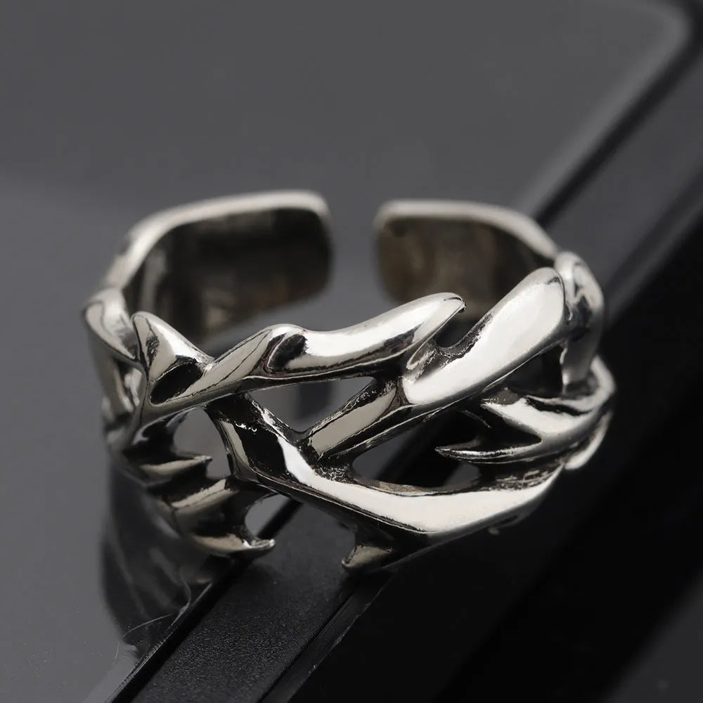 Copper thorn flower ring with adjustable opening and geometric design.