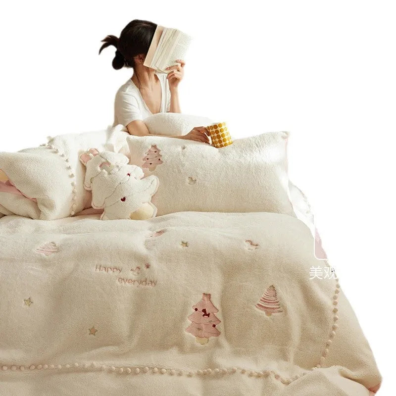 Milk fibre four-piece bedding set with green Christmas tree pattern on bed