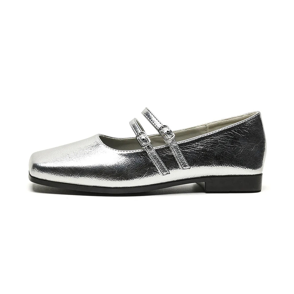 Women's silver genuine leather ballet flats with a cross buckle strap and flat sole.