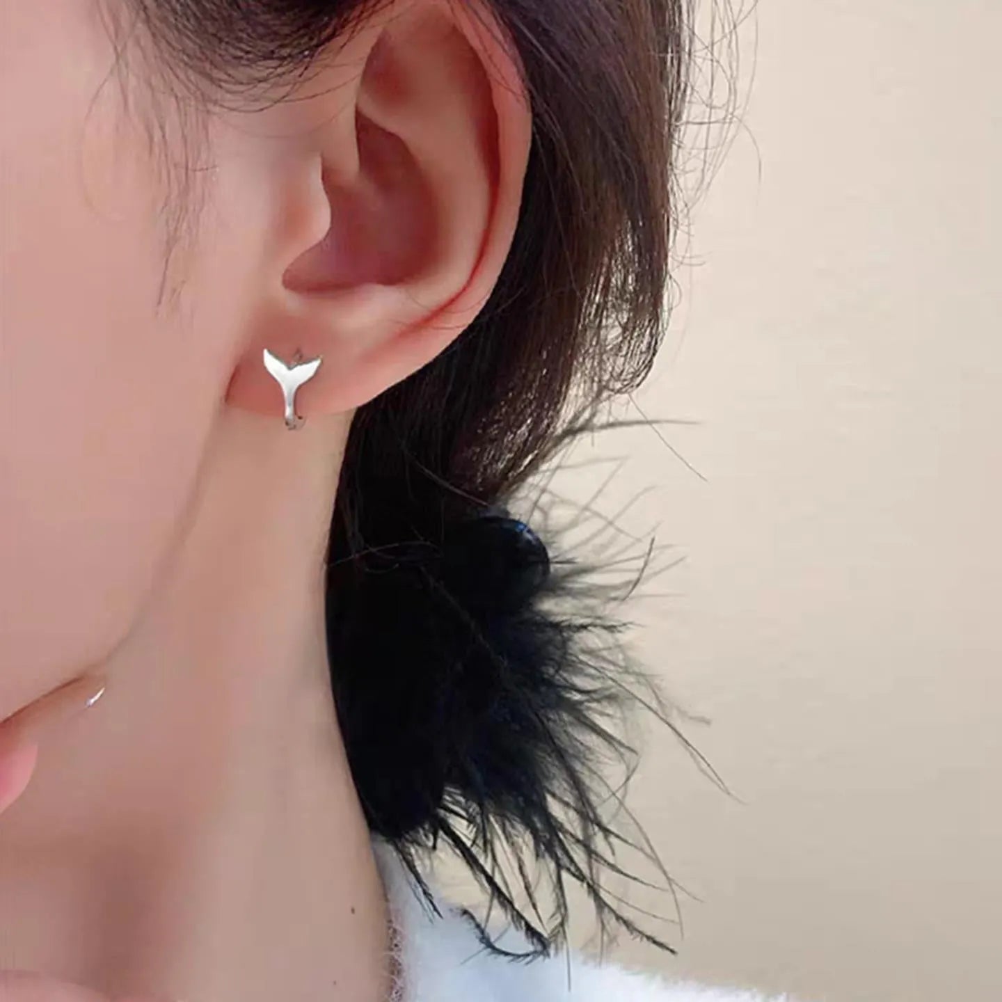Women's fashion fishtail earrings in gold colour with simple design