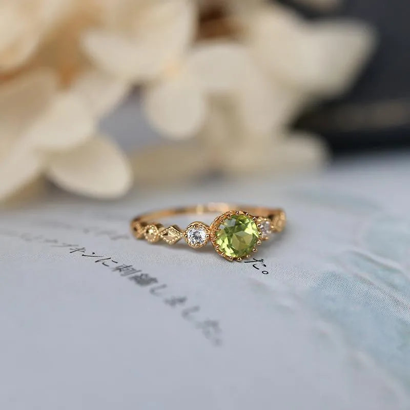 Geometric copper art ring with green imitation peridot finish in retro Japanese style.