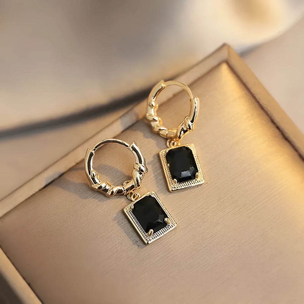 Copper earrings with geometric quadrilateral shape and black zircon stones in French Court retro style