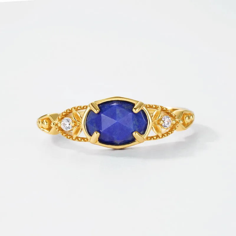 Silver alloy geometric oval ring with lapis lazuli blue stone and round decorative elements