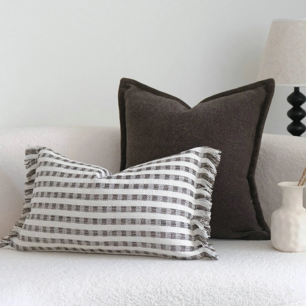 Coffee brown Chinese classical style cushion cover with stripe pattern on a living room sofa